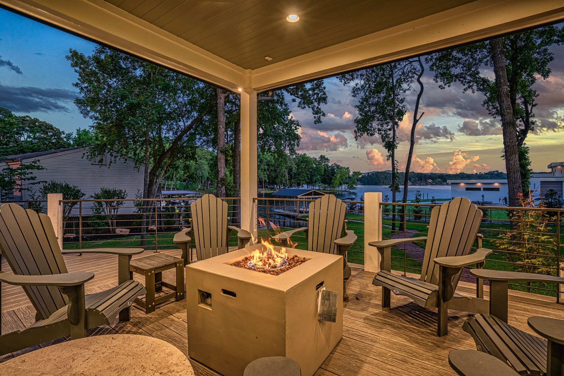 There is a fire pit in the middle of the porch.