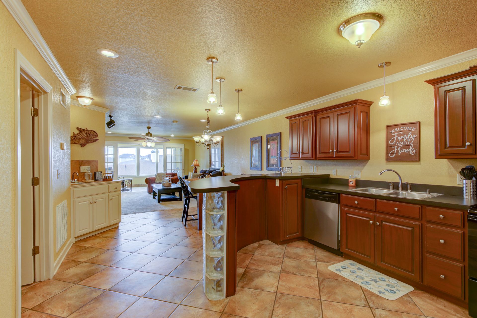 A kitchen with wooden cabinets and stainless steel appliances