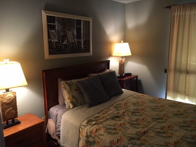 beautiful bedroom set with warm lighting at Willow Beach D8