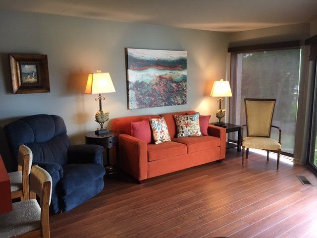 modern living room with colorful furniture at Willow Beach D8