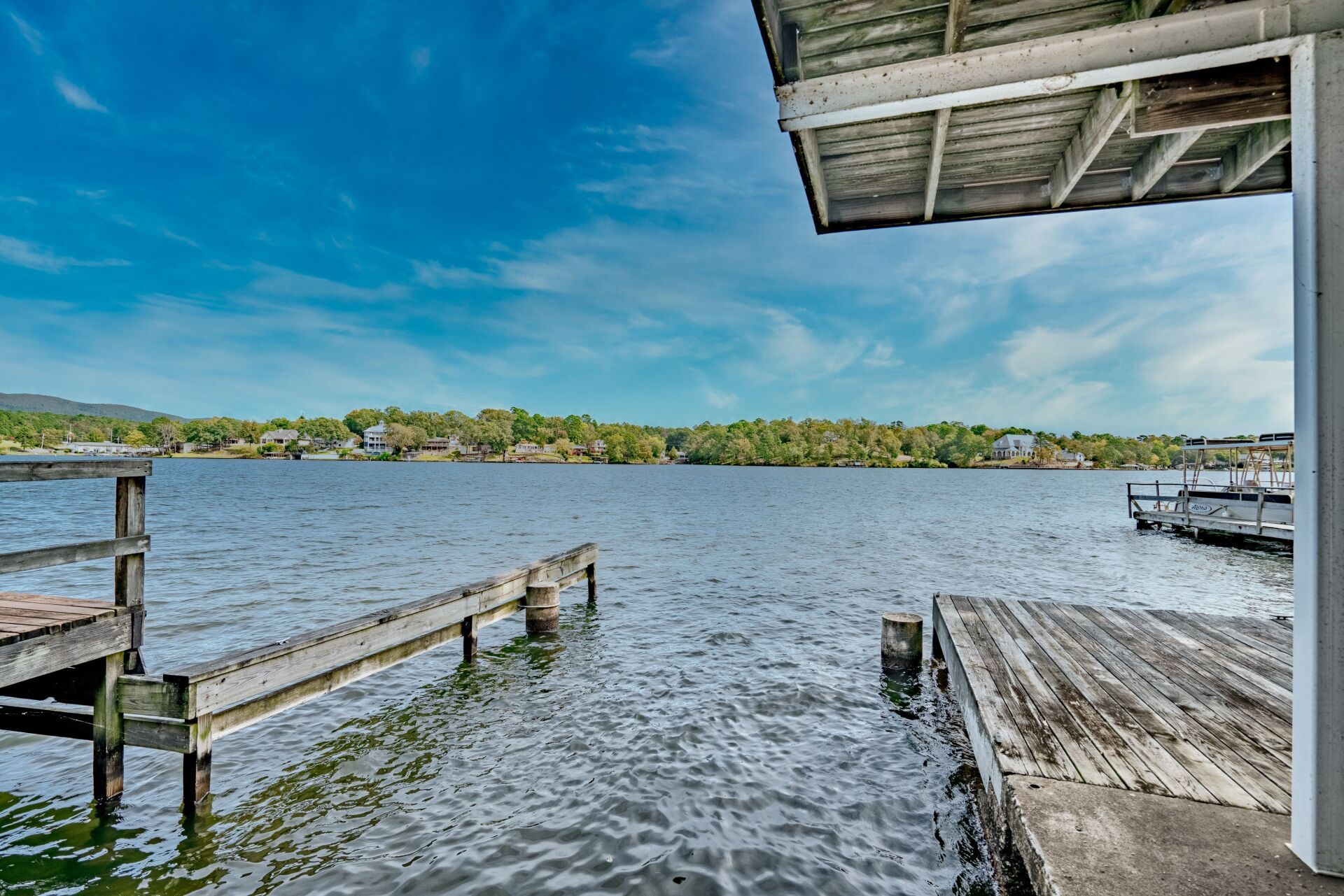 A wooden dock overlooking a large body of water.
