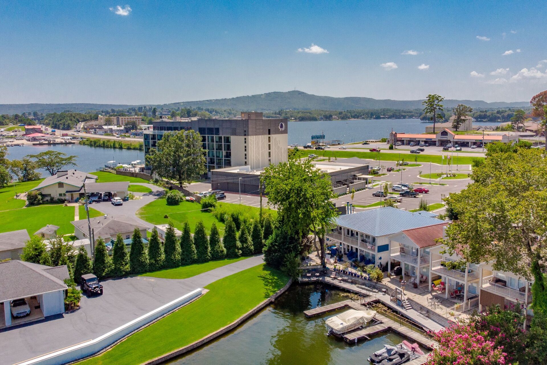 An aerial view of a city with a lake in the background.