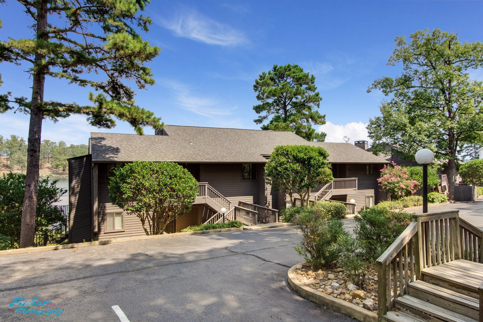 A house with a lot of trees in front of it