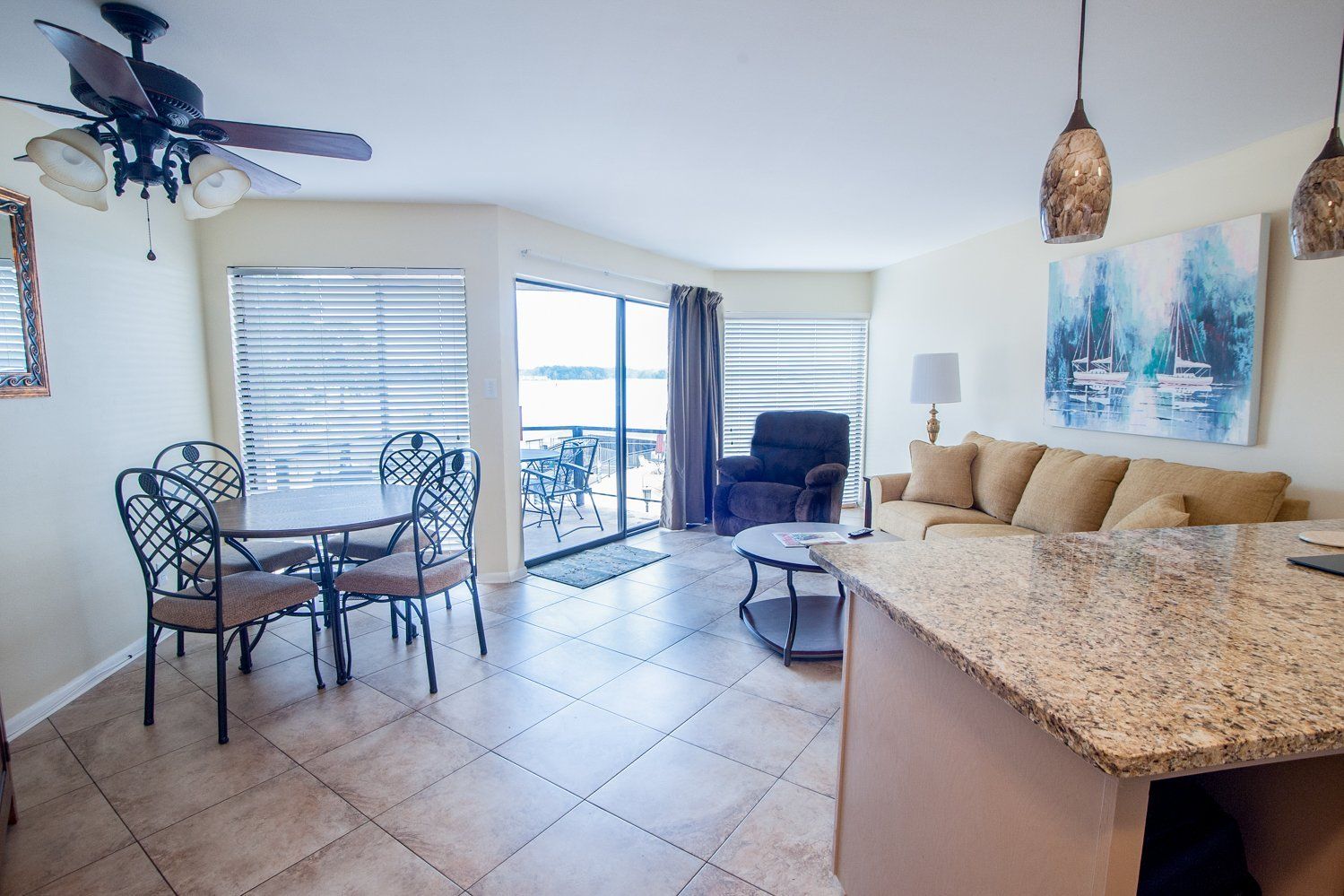 Living room with balcony access at Willow Beach B1