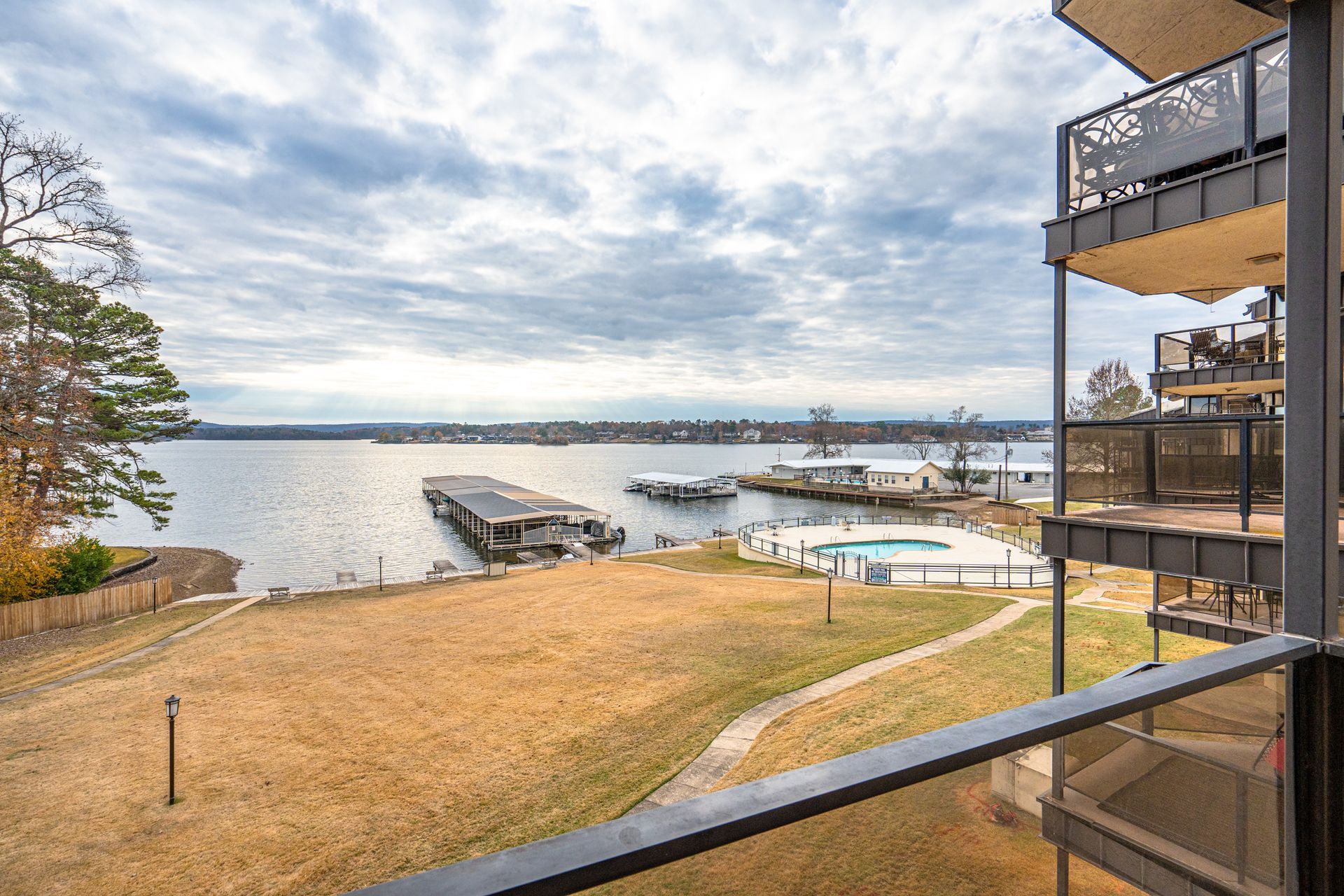 A view of a lake from a balcony of a building.