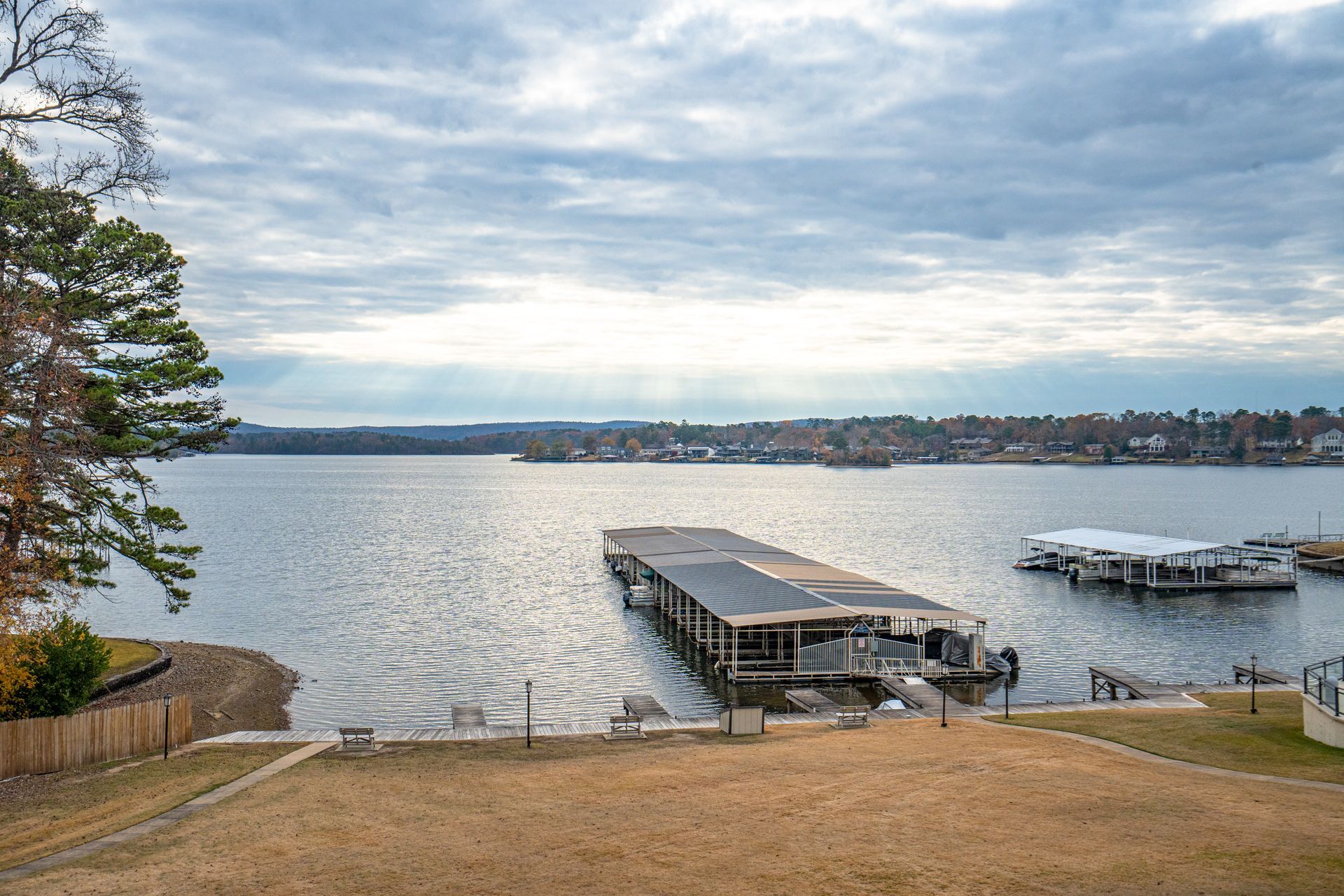 A large body of water with a dock in the middle of it.