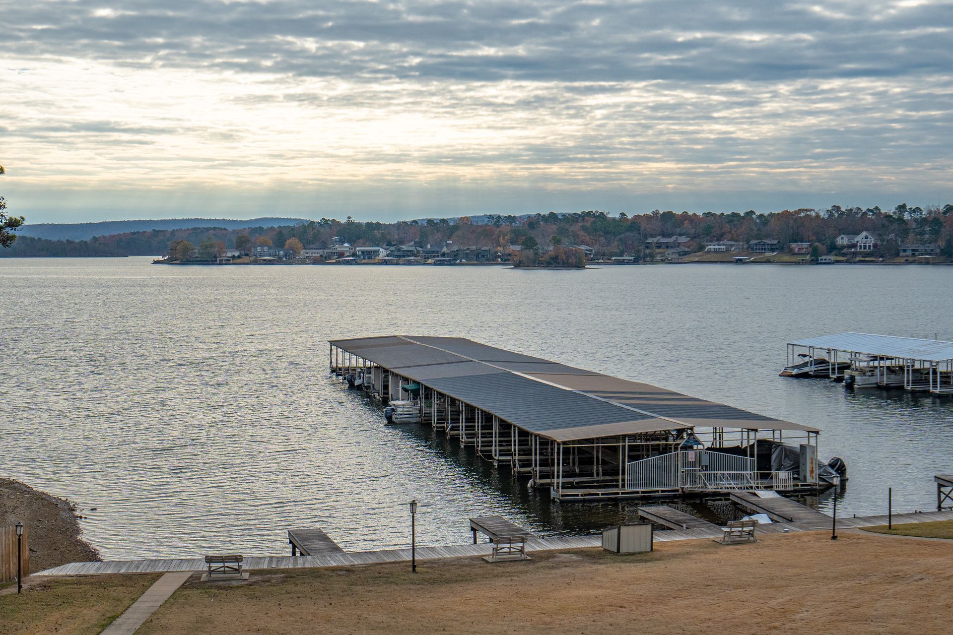 A large body of water with a dock in the middle of it.