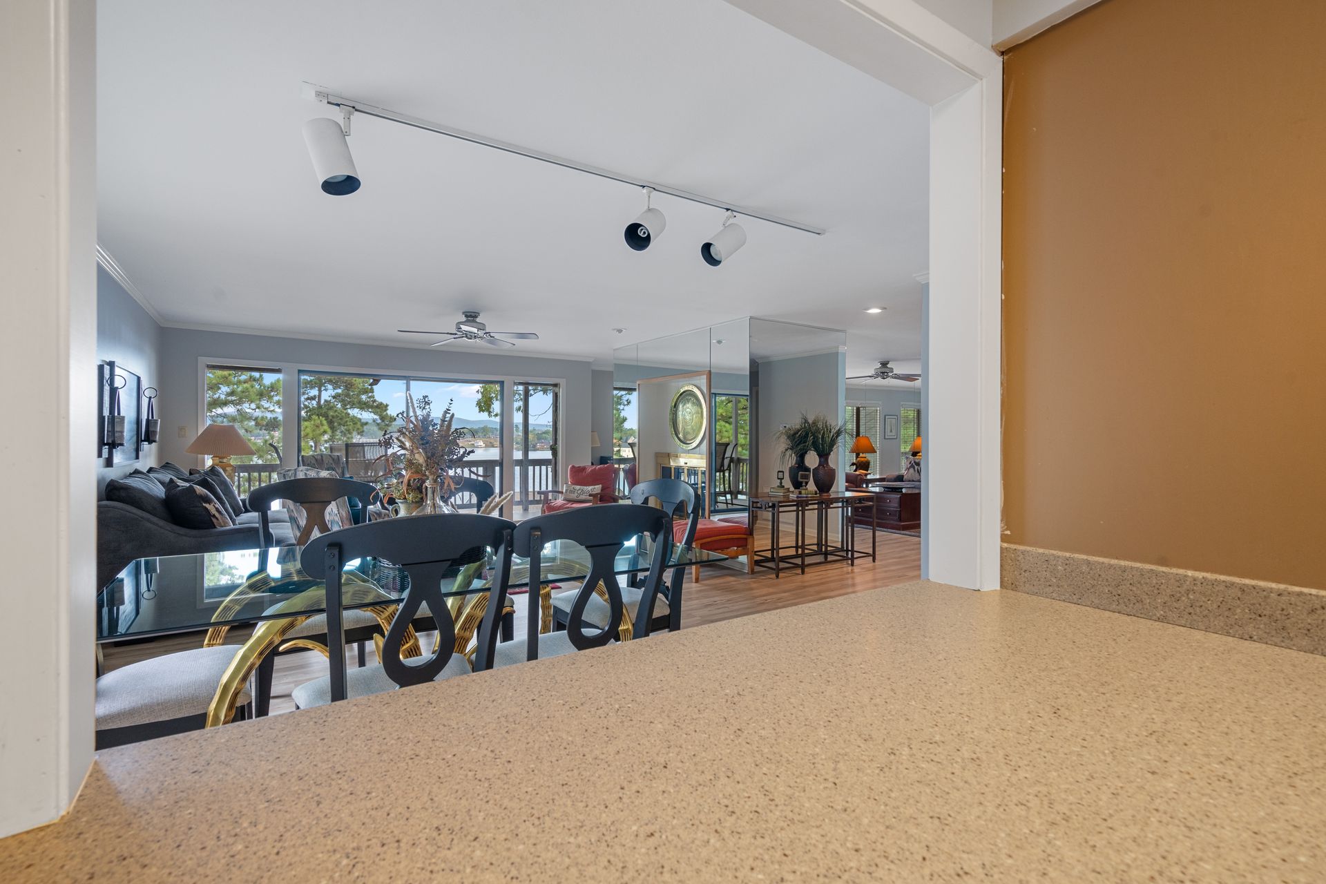A large living room with a staircase leading up to the second floor.