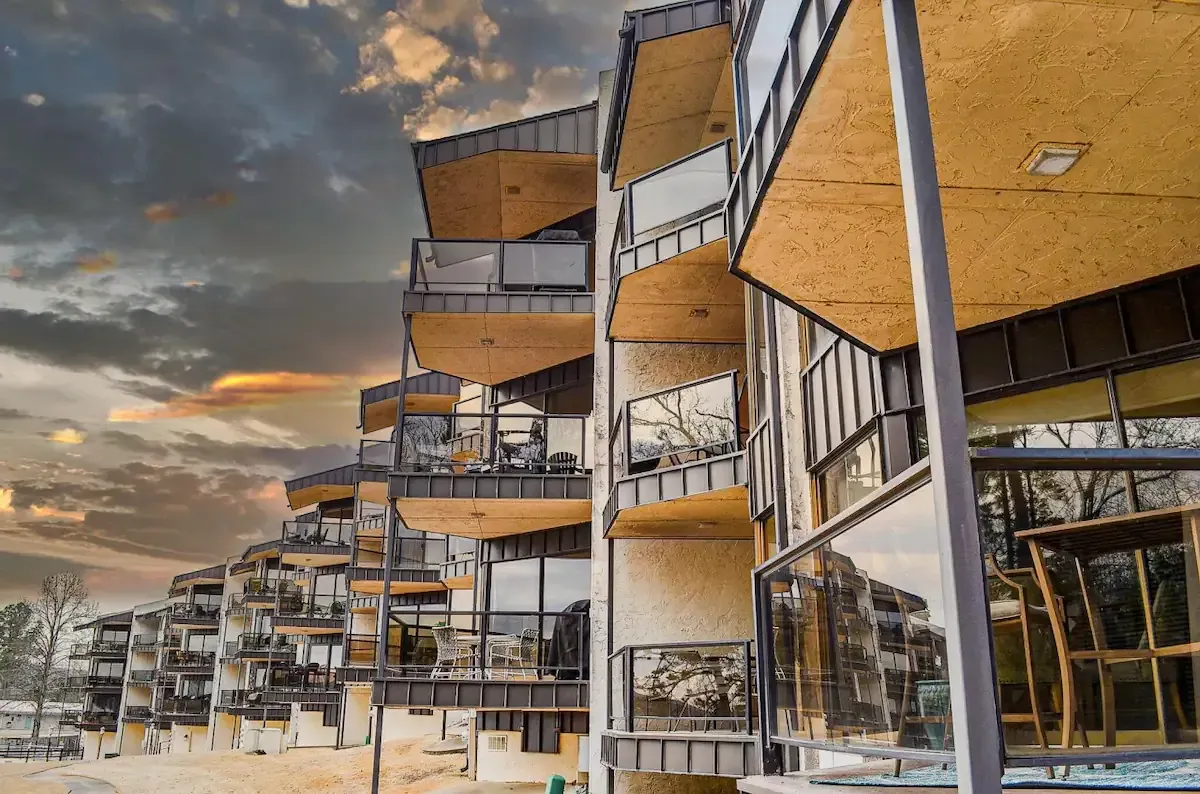 A large apartment building with a lot of windows and balconies.