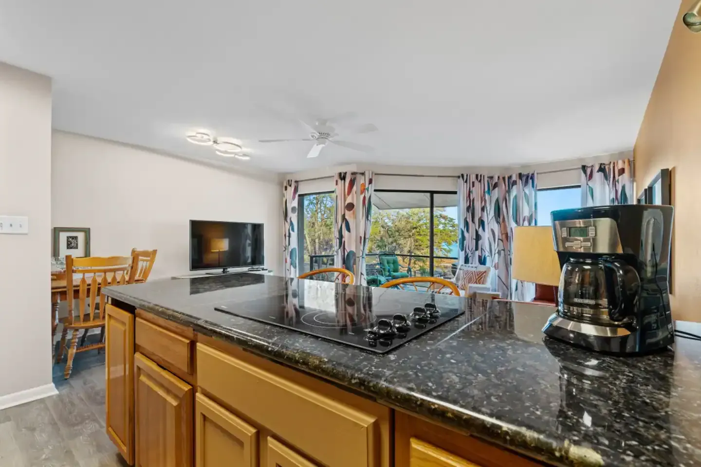 There is a coffee maker on the counter in the kitchen.