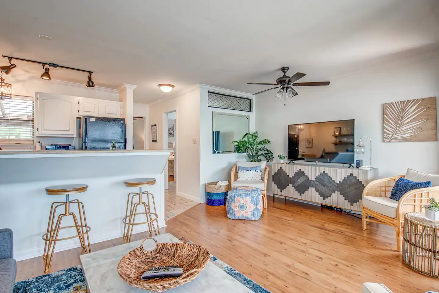 A living room filled with furniture and a flat screen tv.