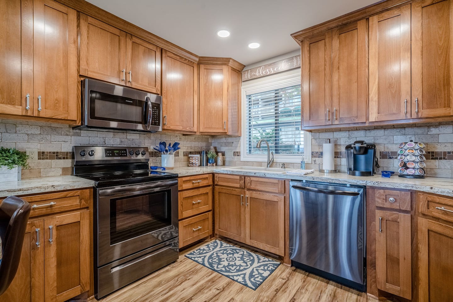 A kitchen with wooden cabinets and stainless steel appliances.
