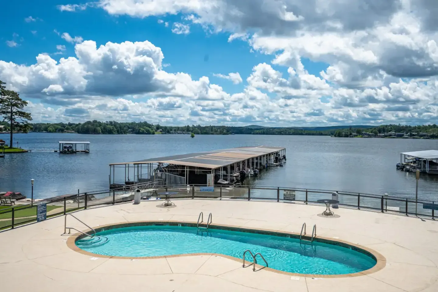 There is a large swimming pool in the middle of a lake.
