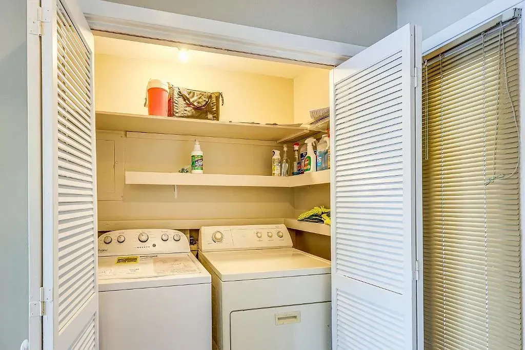 A laundry room with a washer and dryer in it.