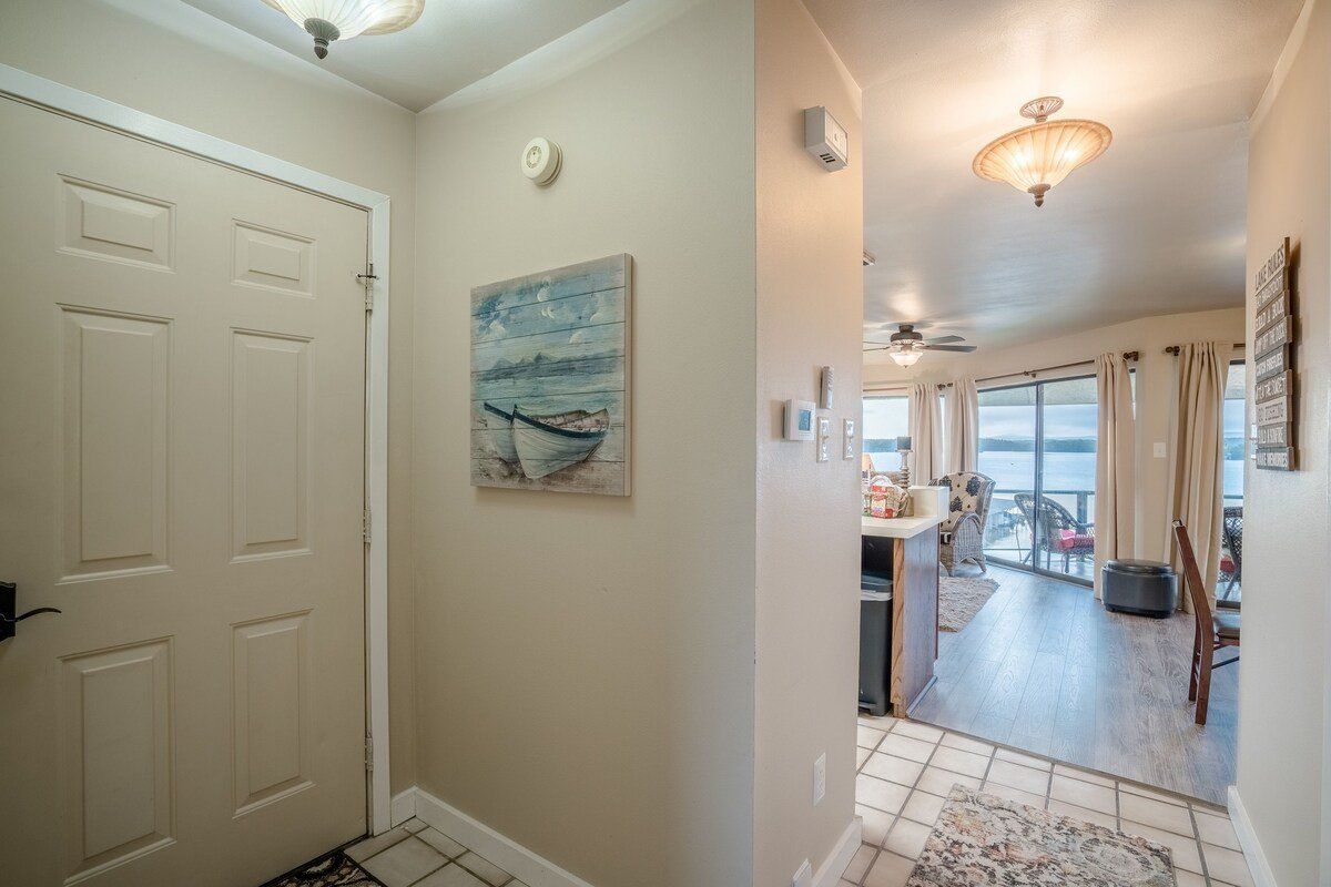 A hallway in a house with a painting on the wall.