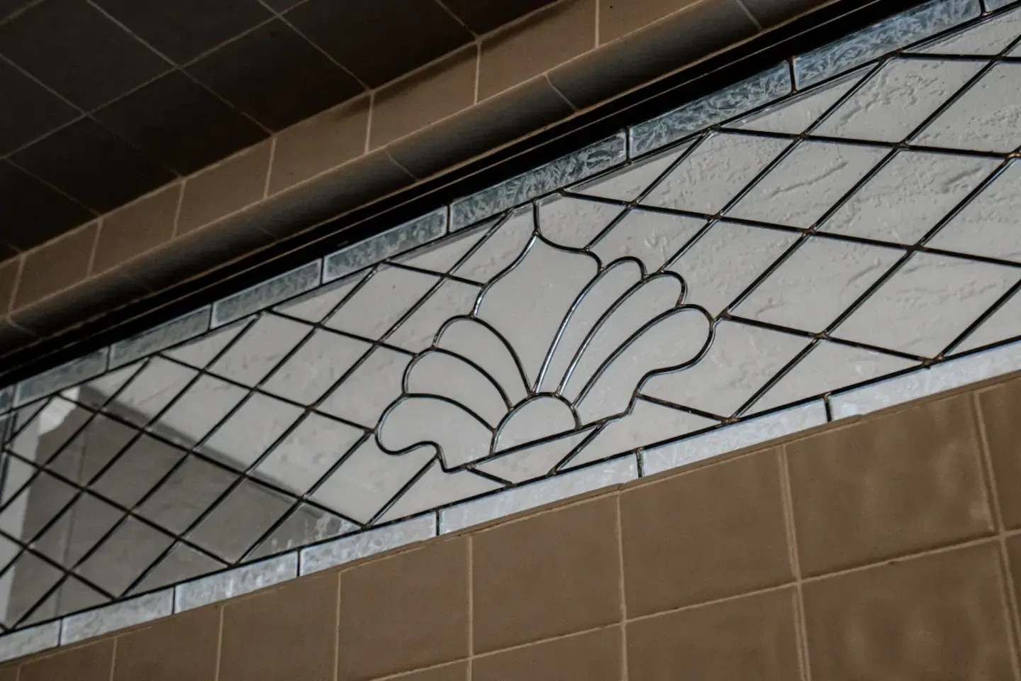 A close up of a stained glass window on a wall