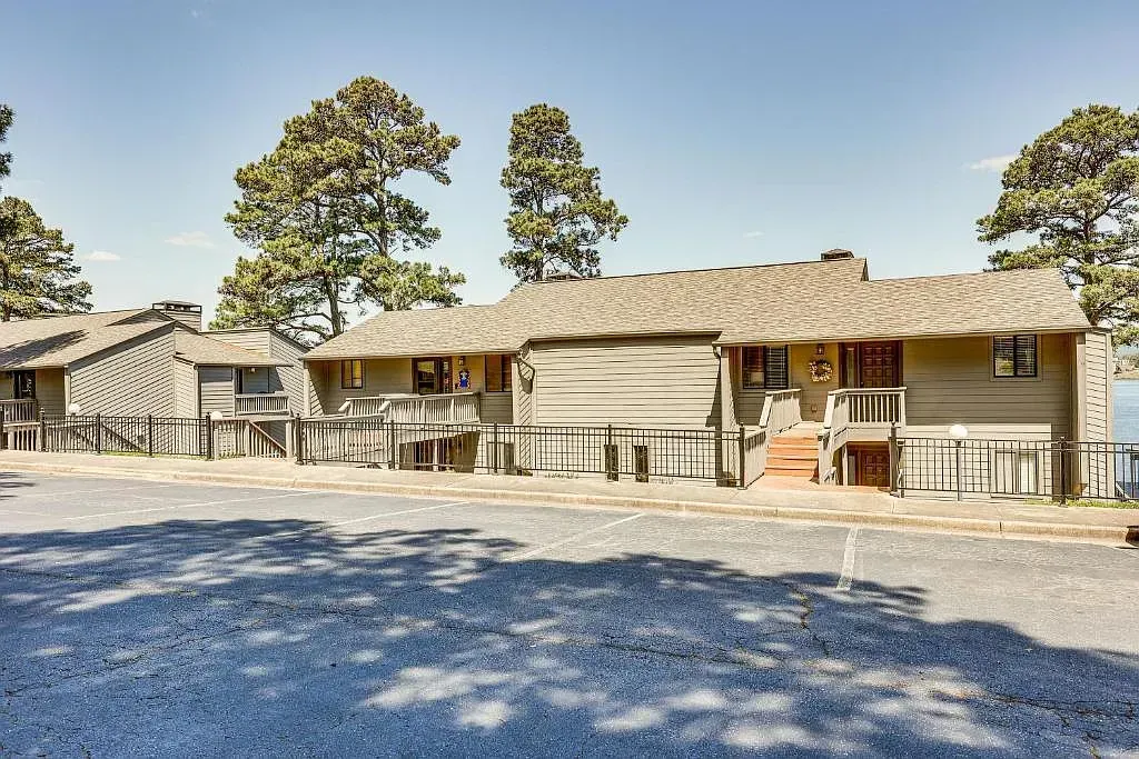 A house with a lot of trees in front of it