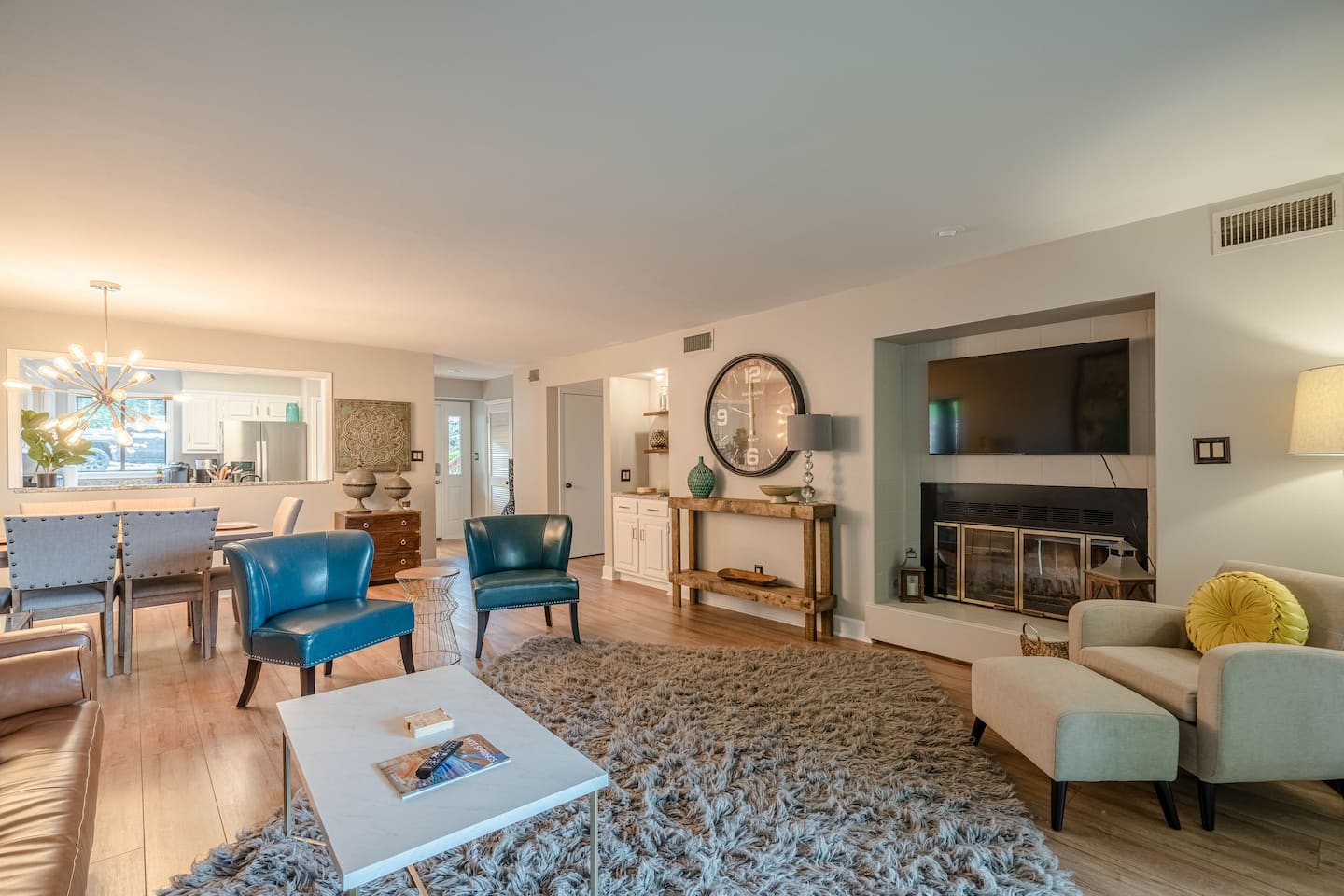 A living room filled with furniture and a fireplace.
