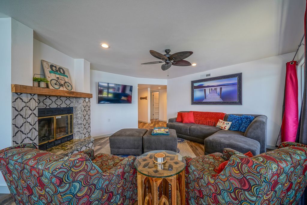 A living room filled with furniture and a fireplace.