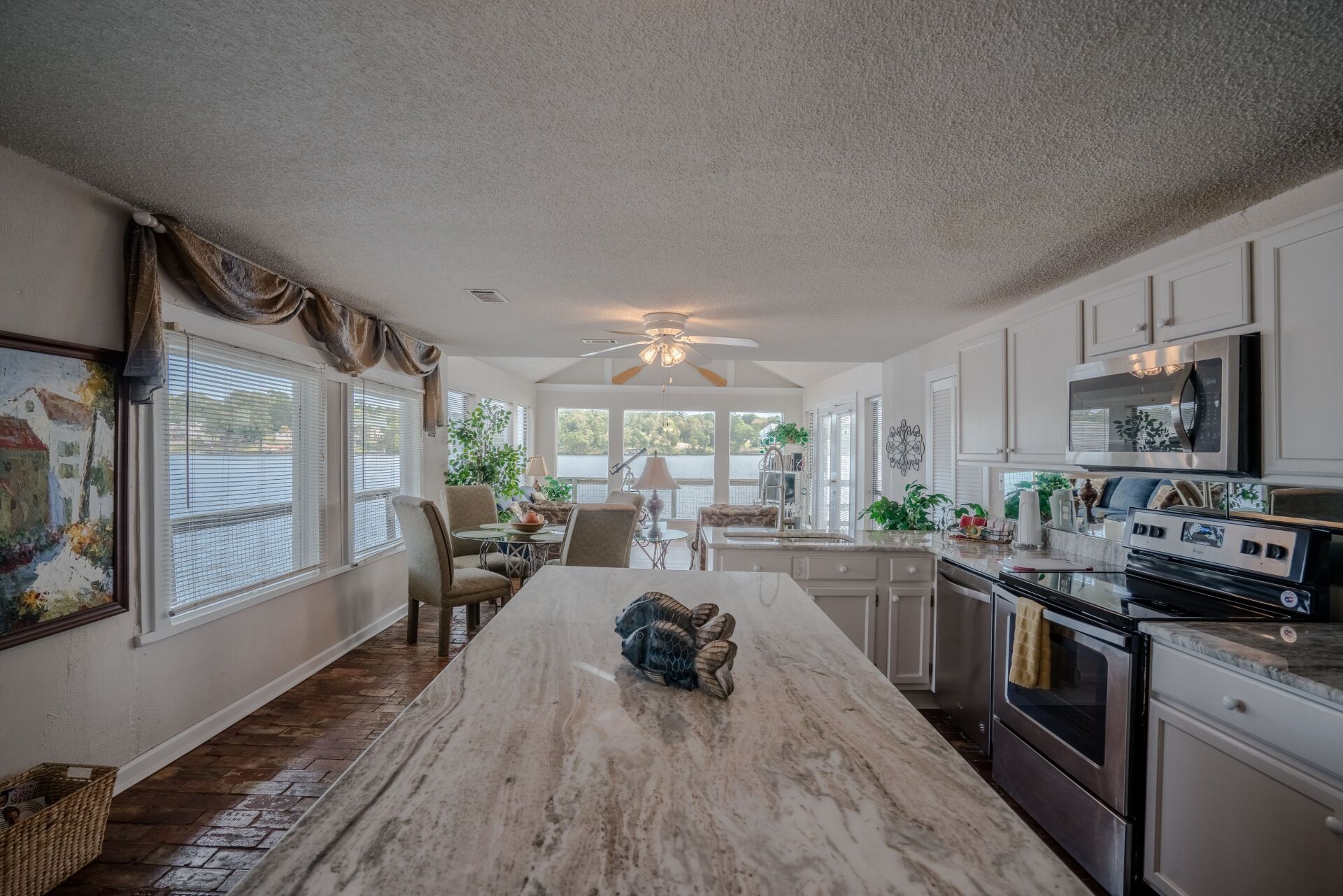 There is a large island in the middle of the kitchen.