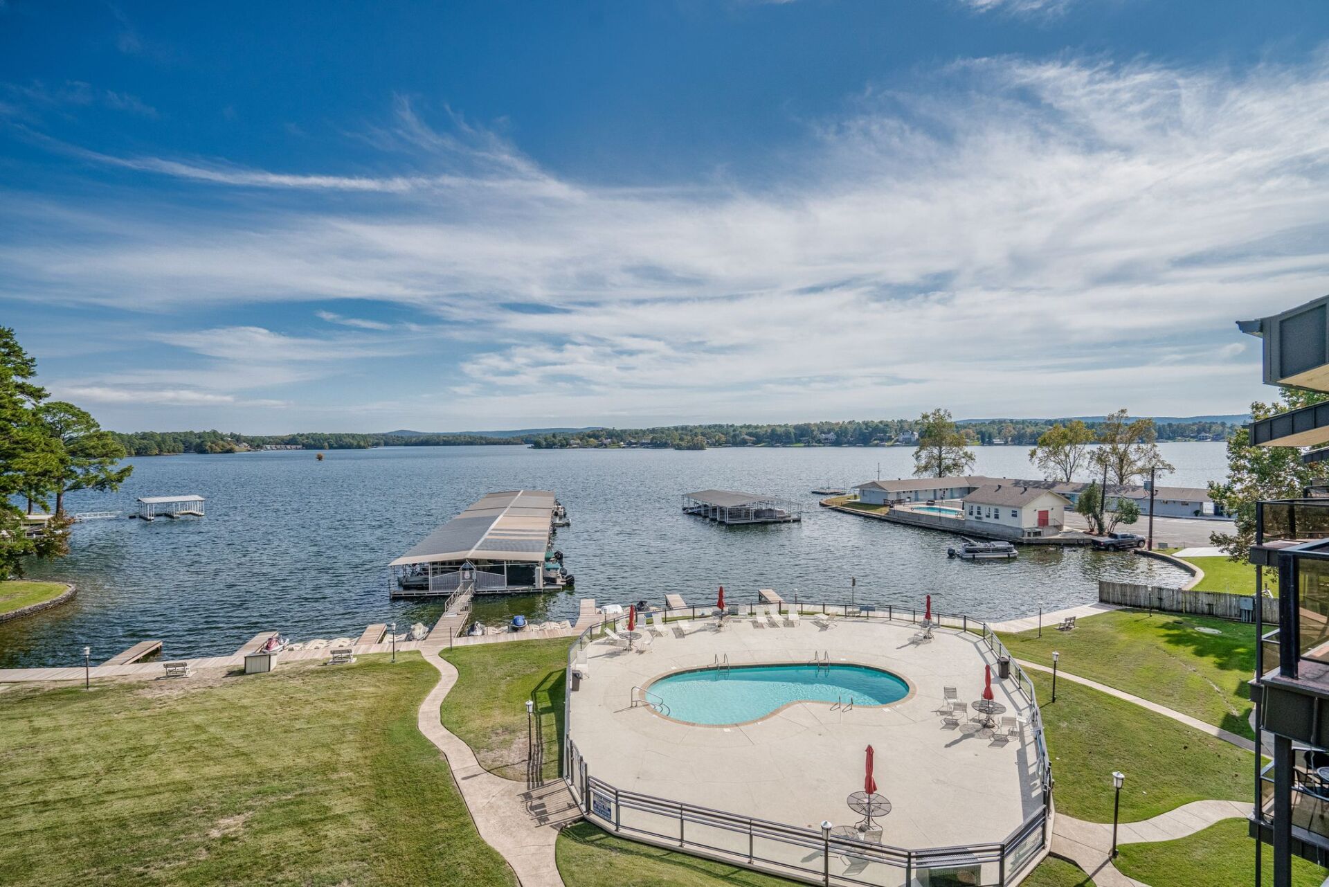 There is a large swimming pool in the middle of a lake.