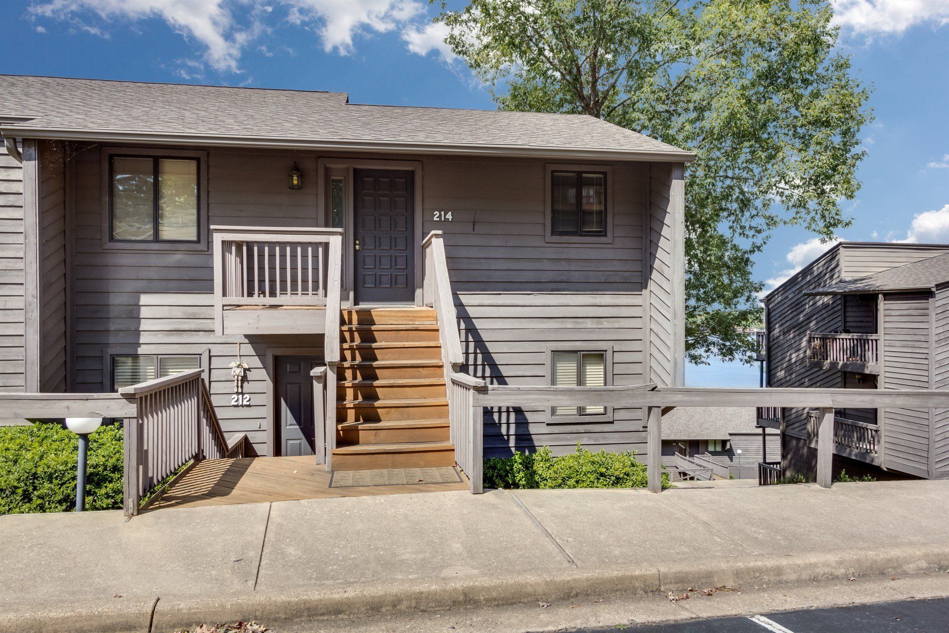 A house with stairs leading up to the front door