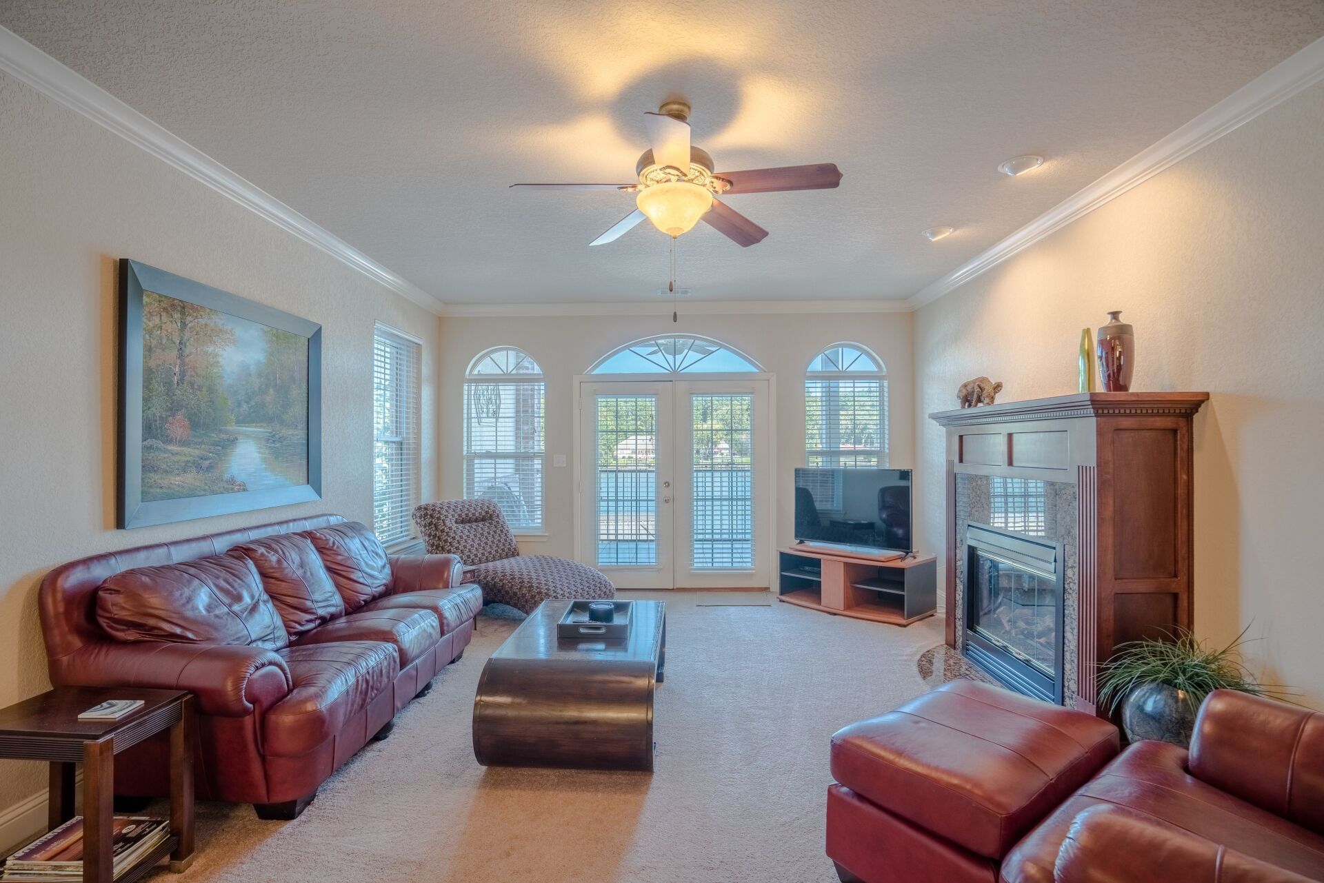 A living room filled with furniture and a fireplace.