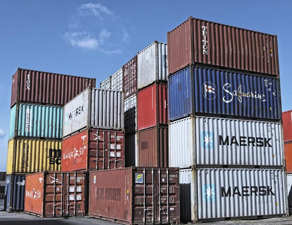 Many Shipping Containers Are Stacked On Top Of Each Other — Oz Shipping Containers in Grafton, NSW