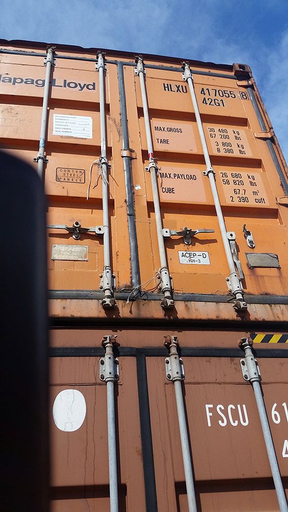 An Orange Shipping Container With The Word Fscu On It — Oz Shipping Containers in Teralba, NSW