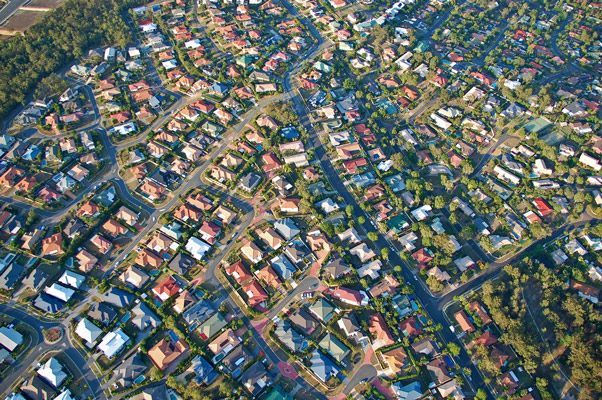 An Aerial View Of A Residential Area With Lots Of Houses And Trees — Oz Shipping Containers in Brisbane, QLD