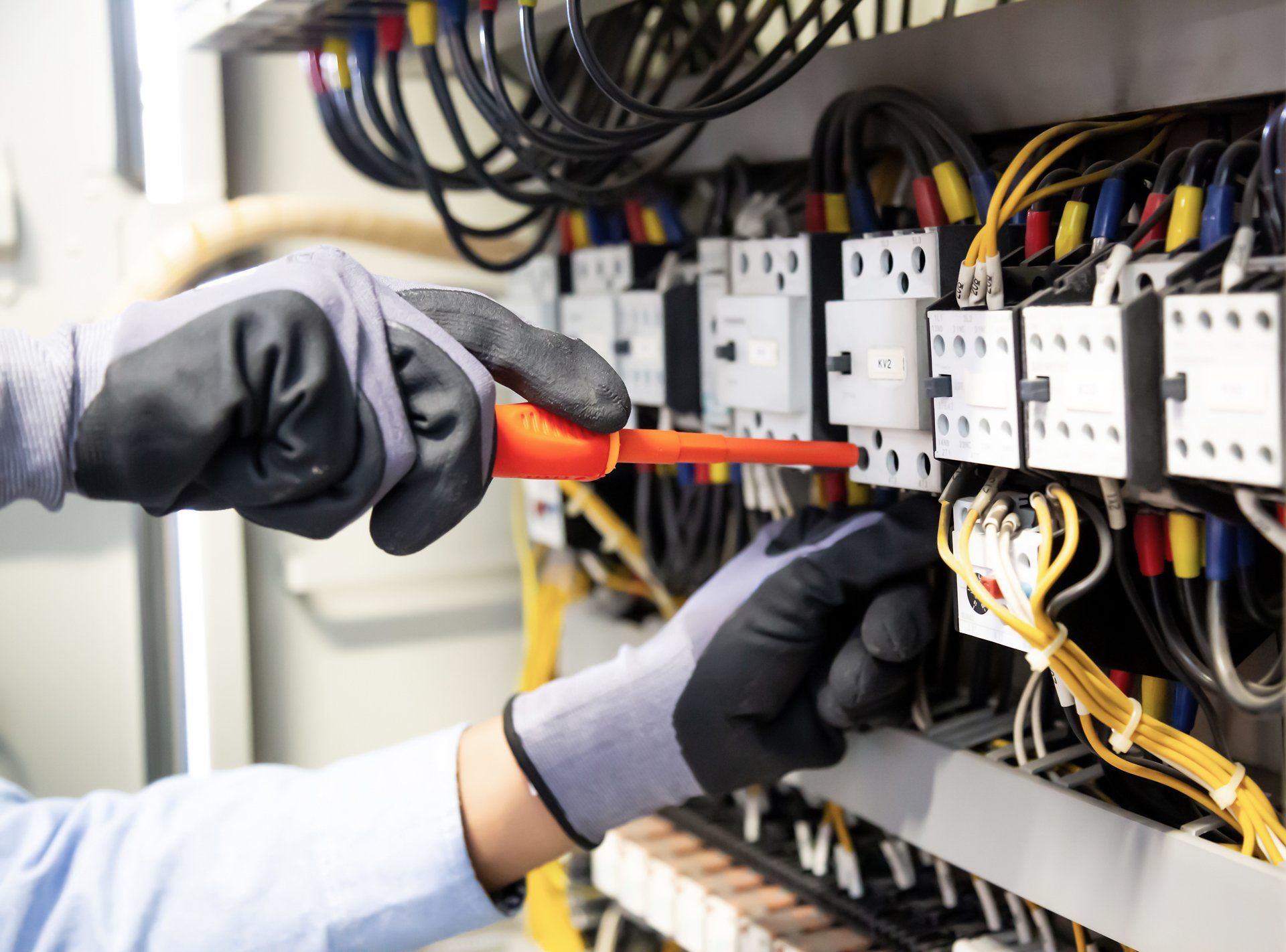 Professional Electrician Repairing Electrical System