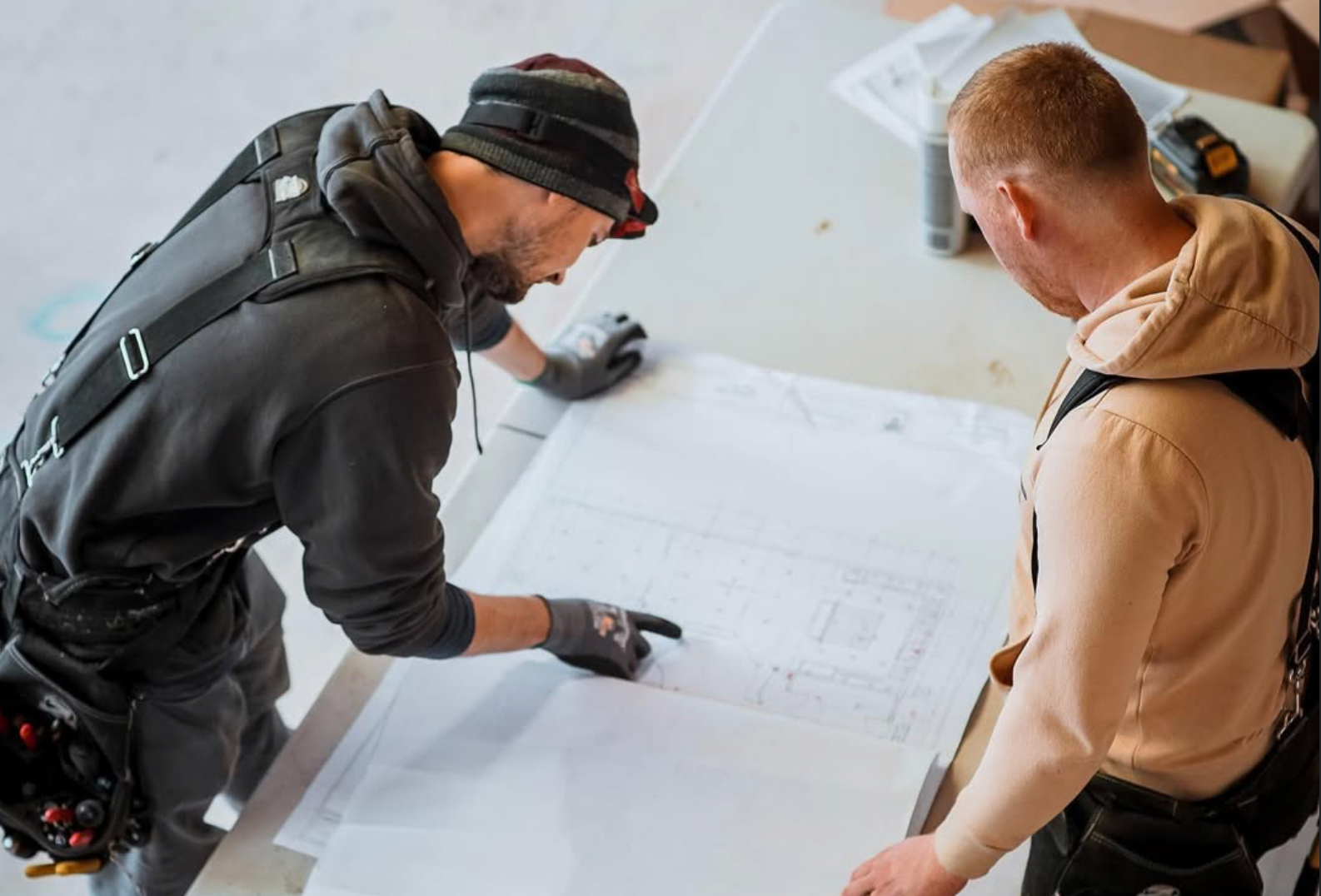 Bedroom with built-in closet, white doors, shelves, drawers, wood floor, gray walls, and a window.