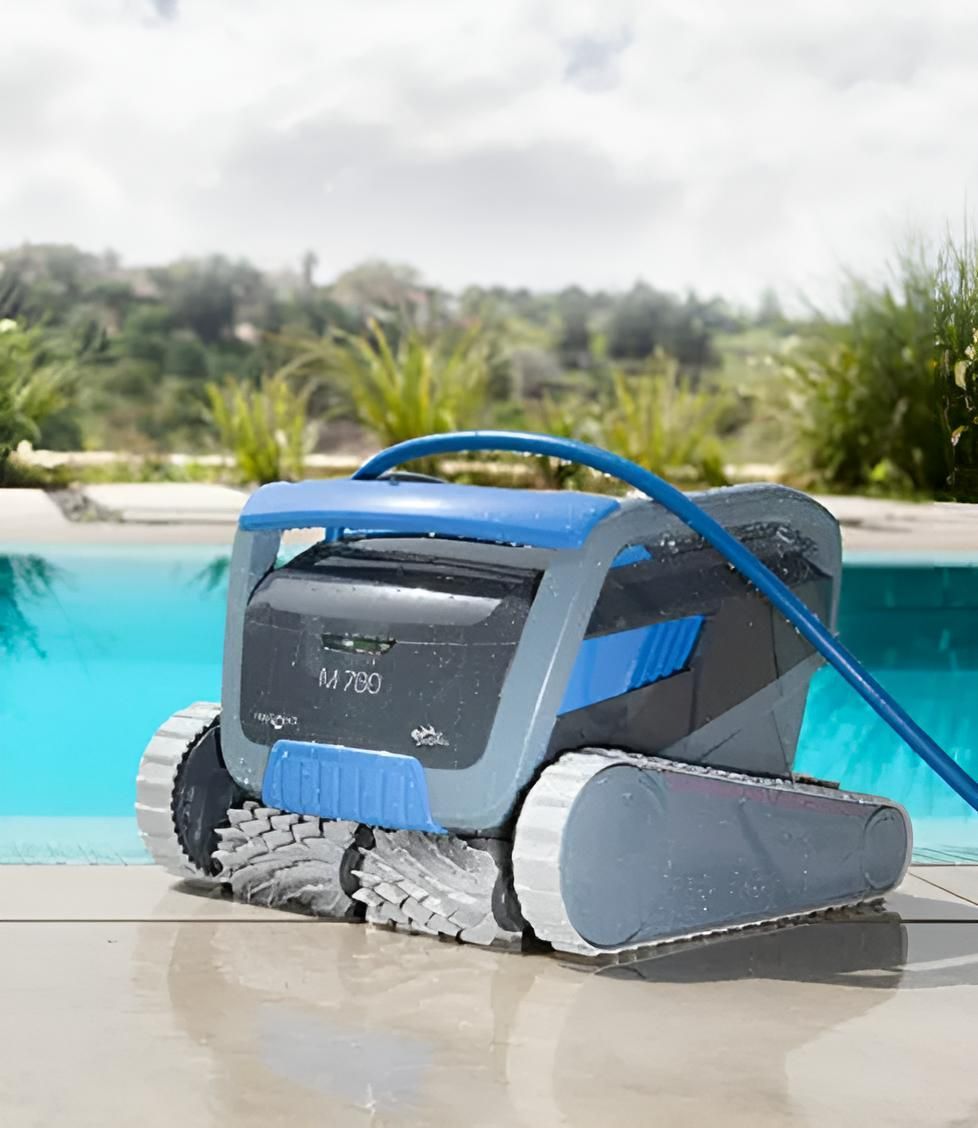 A Robotic Pool Cleaner is Sitting on the Edge of a Swimming Pool — Taree Pool Supplies in Taree, NSW