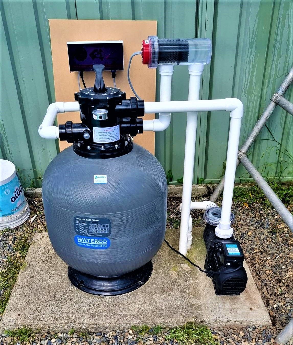 A Swimming Pool Filter With a Pump Attached to It — Taree Pool Supplies in Taree, NSW