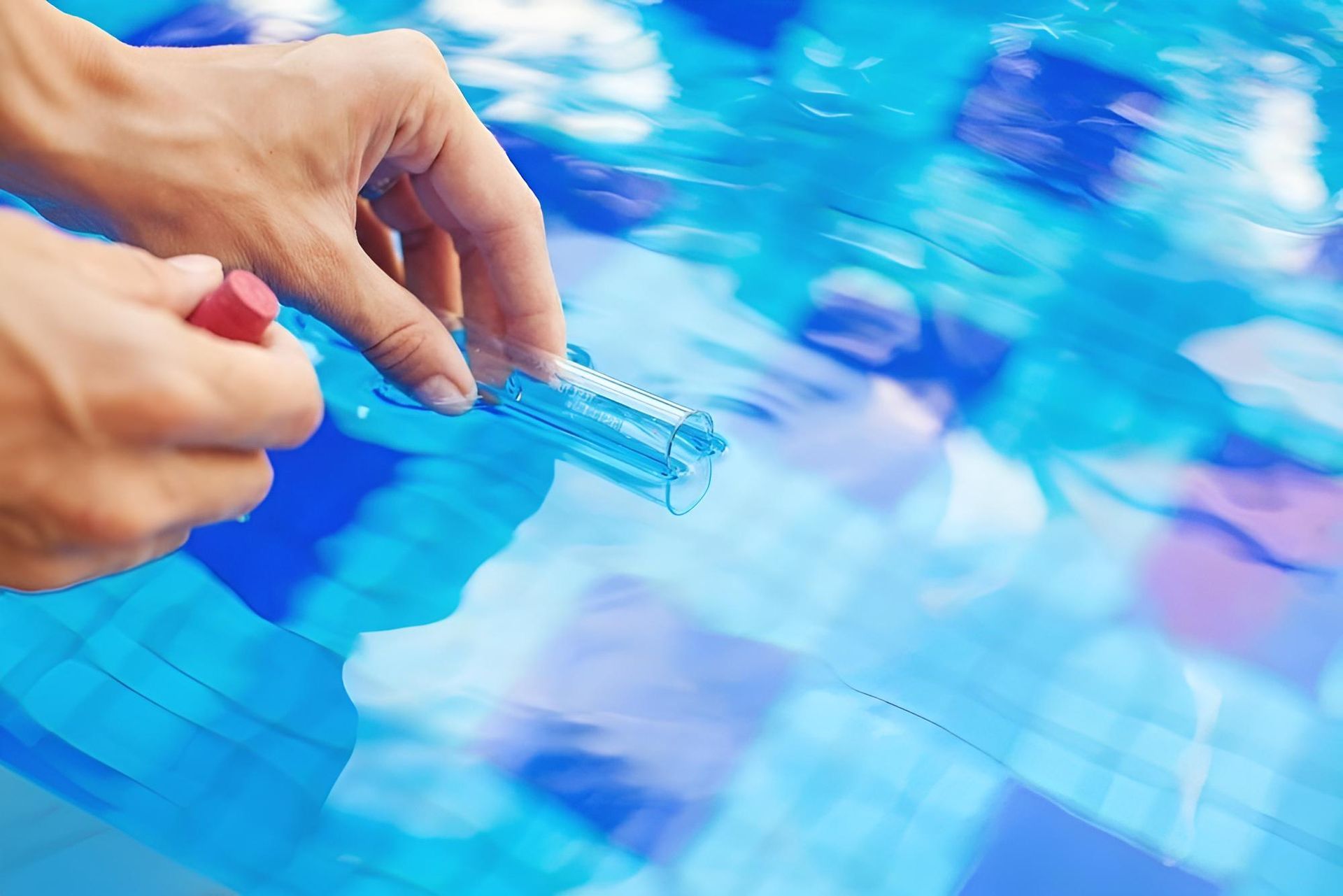 A Person is Taking a Test of the Water in a Swimming Pool — Taree Pool Supplies in Forster, NSW