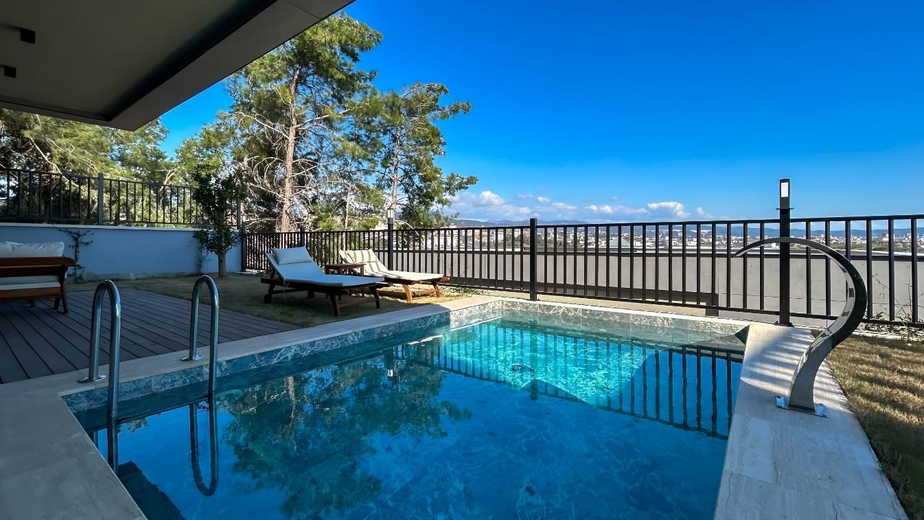 There is a Large Swimming Pool in the Backyard of a House — Taree Pool Supplies in Hallidays Point, NSW