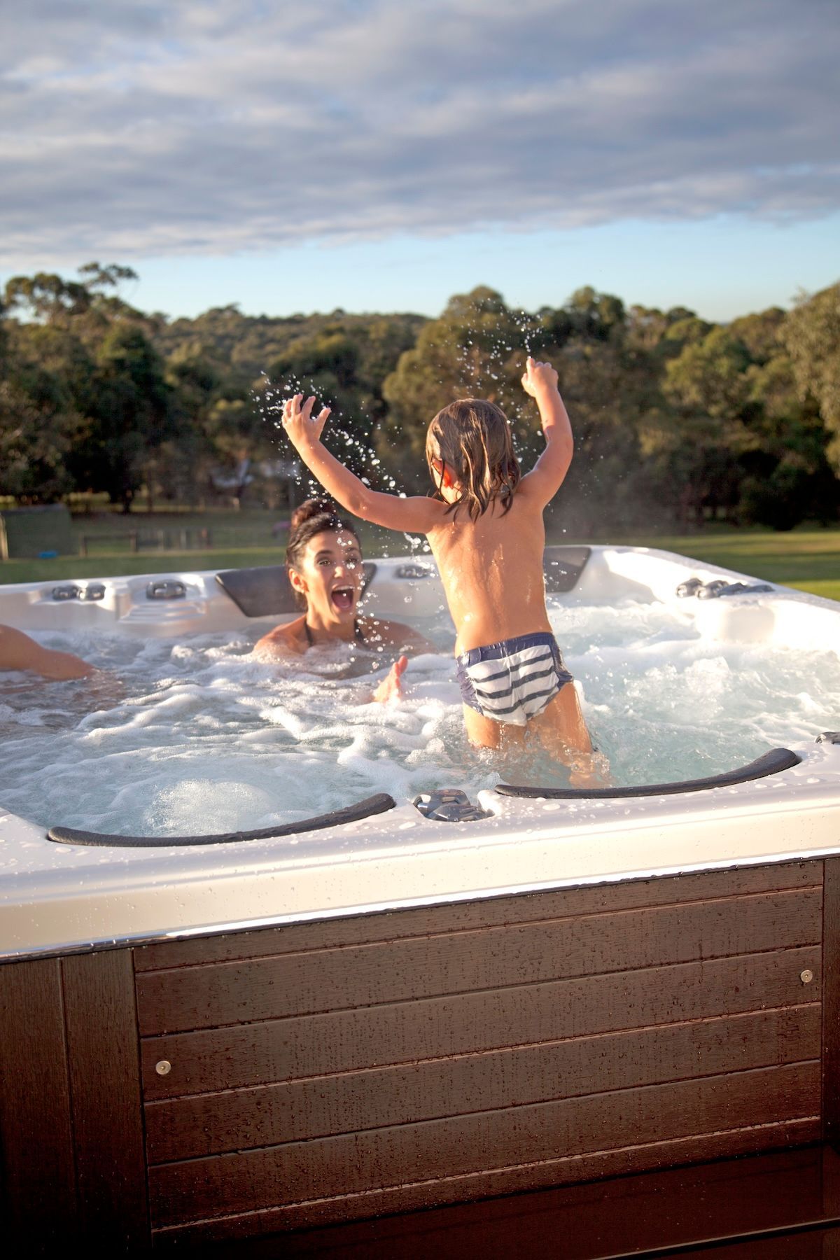 A Boy and a Girl Are Playing in a Hot Tub — Taree Pool Supplies in Taree, NSW