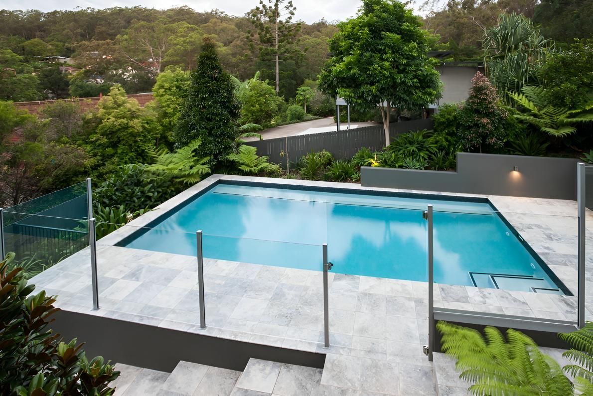 A Large Swimming Pool With Stairs Leading to It — Taree Pool Supplies in Hallidays Point, NSW