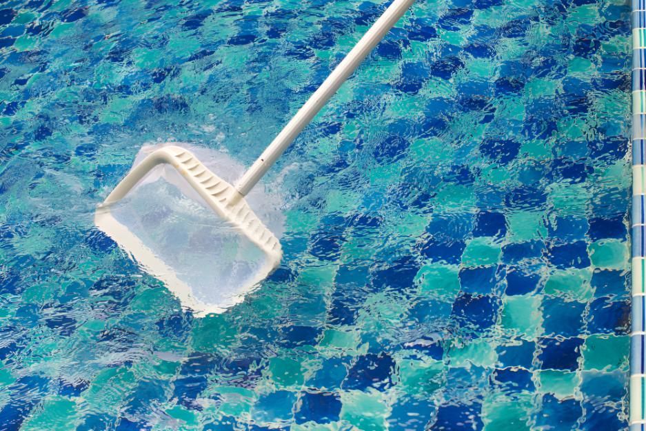 A Pool Cleaner is Being Used to Clean a Swimming Pool — Taree Pool Supplies in Taree, NSW