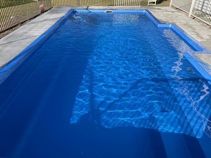 Cleaning a Large Swimming Pool — Taree Pool Supplies in Taree, NSW