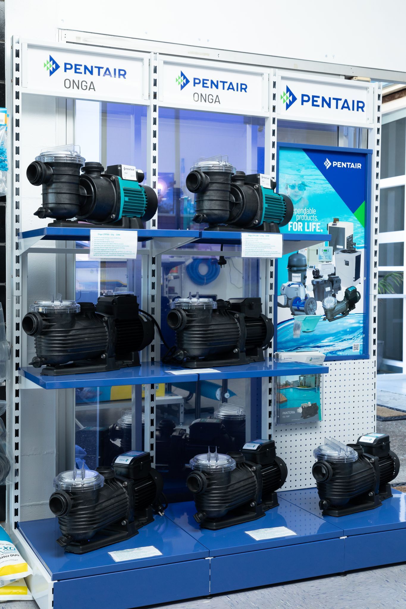 A display of swimming pool pumps in a store — Taree Pool Supplies in Taree, NSW