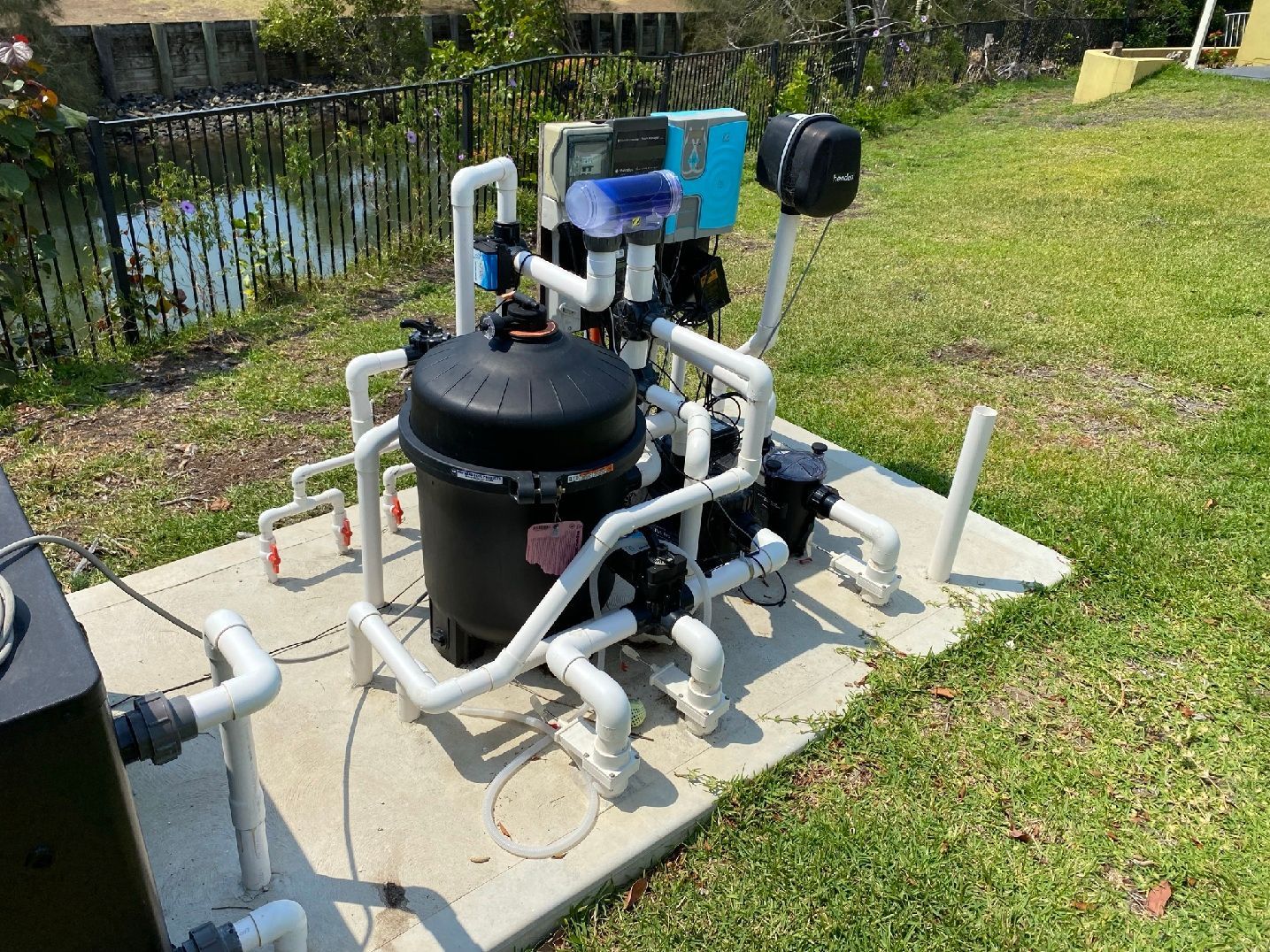 Outdoor Pool Pump And Filtration System With Pipes And Controls