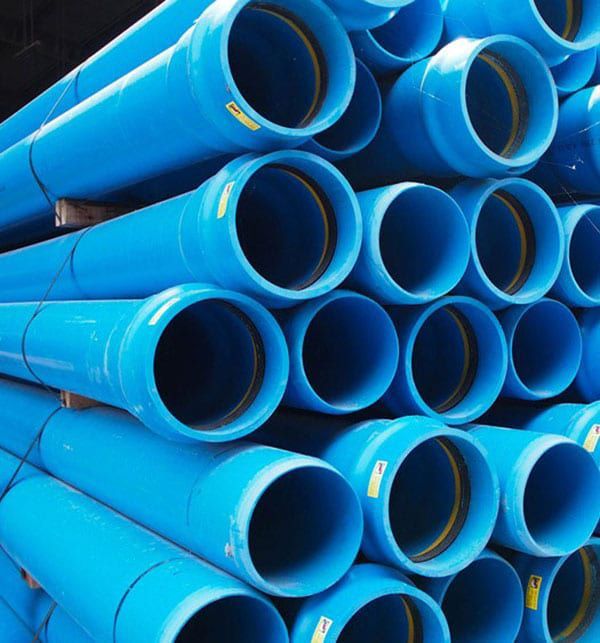 A Bunch of Blue Pipes Stacked on Top of Each Other — Taree Pool Supplies in Harrington, NSW