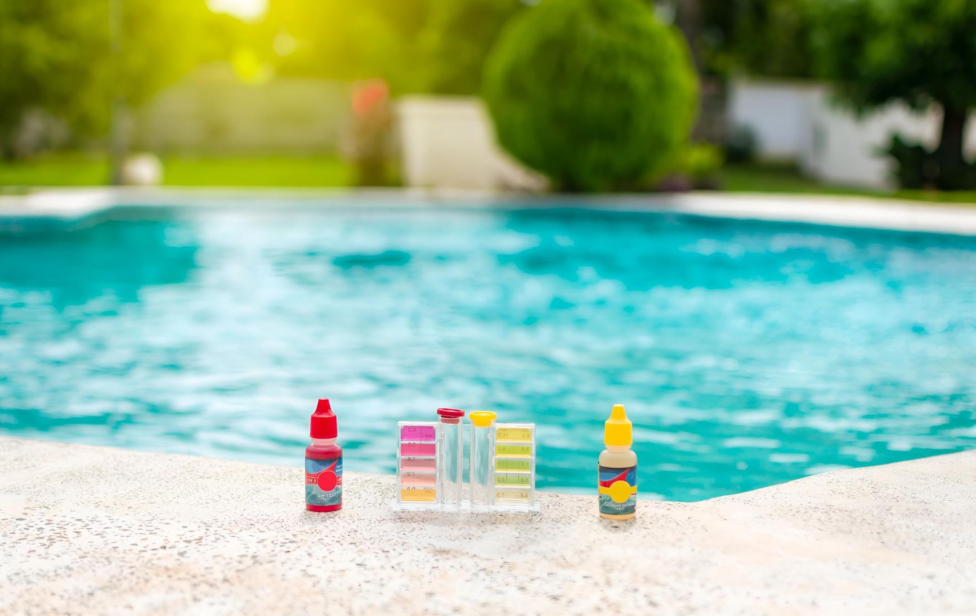 A Bottle of Chemicals is Sitting on the Edge of a Swimming Pool — Taree Pool Supplies in Forster, NSW
