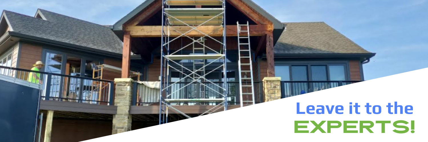 A house under construction with scaffolding on a deck and the text 