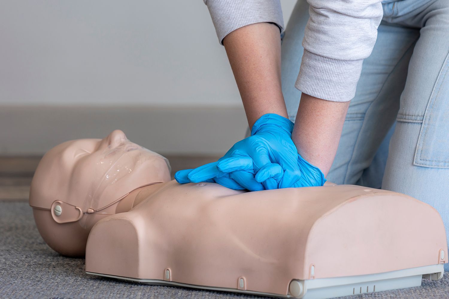 An instructor is demonstrating CPR technique. An instructor is demonstrating CPR technique.