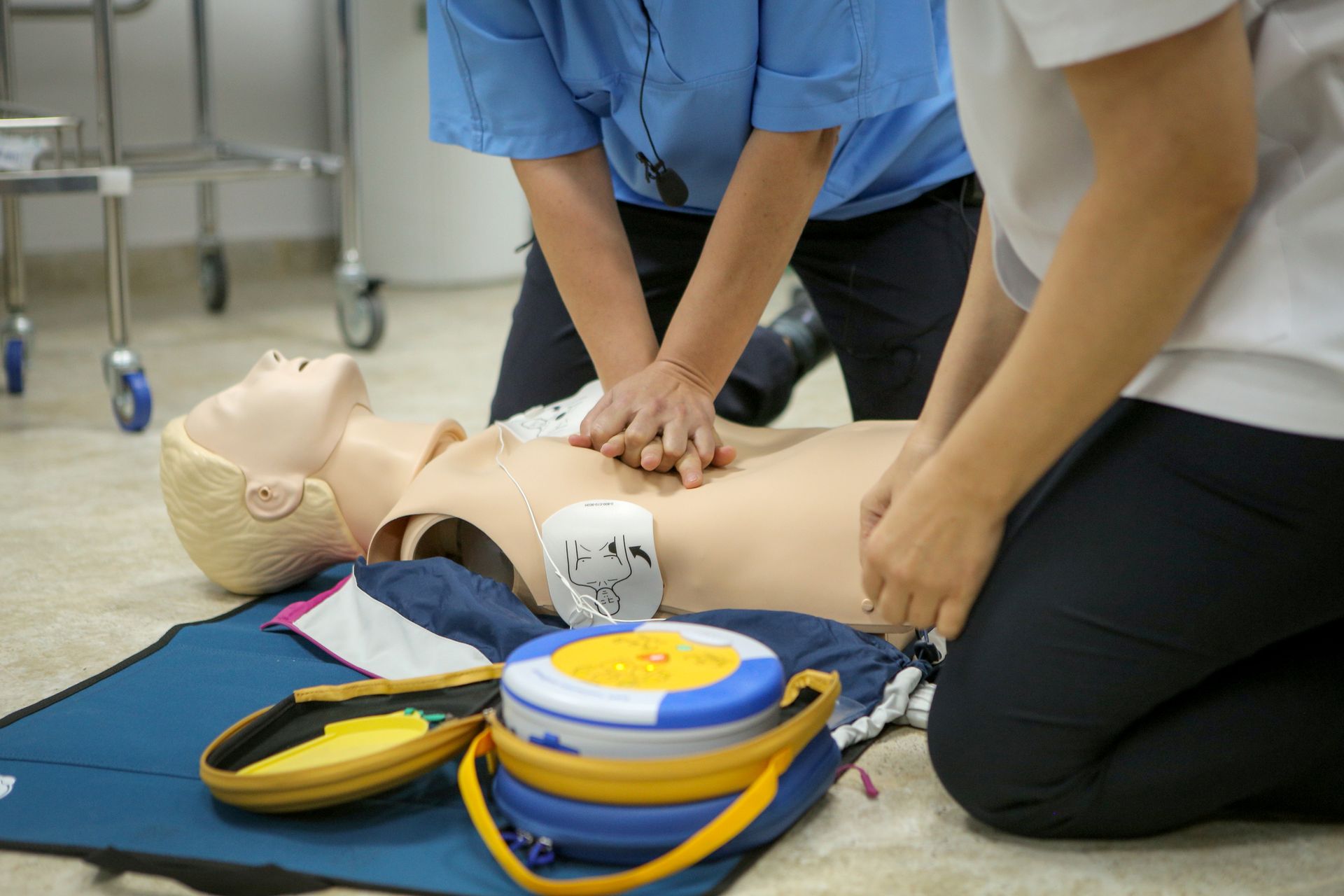 Woman medic demonstrates CPR methods