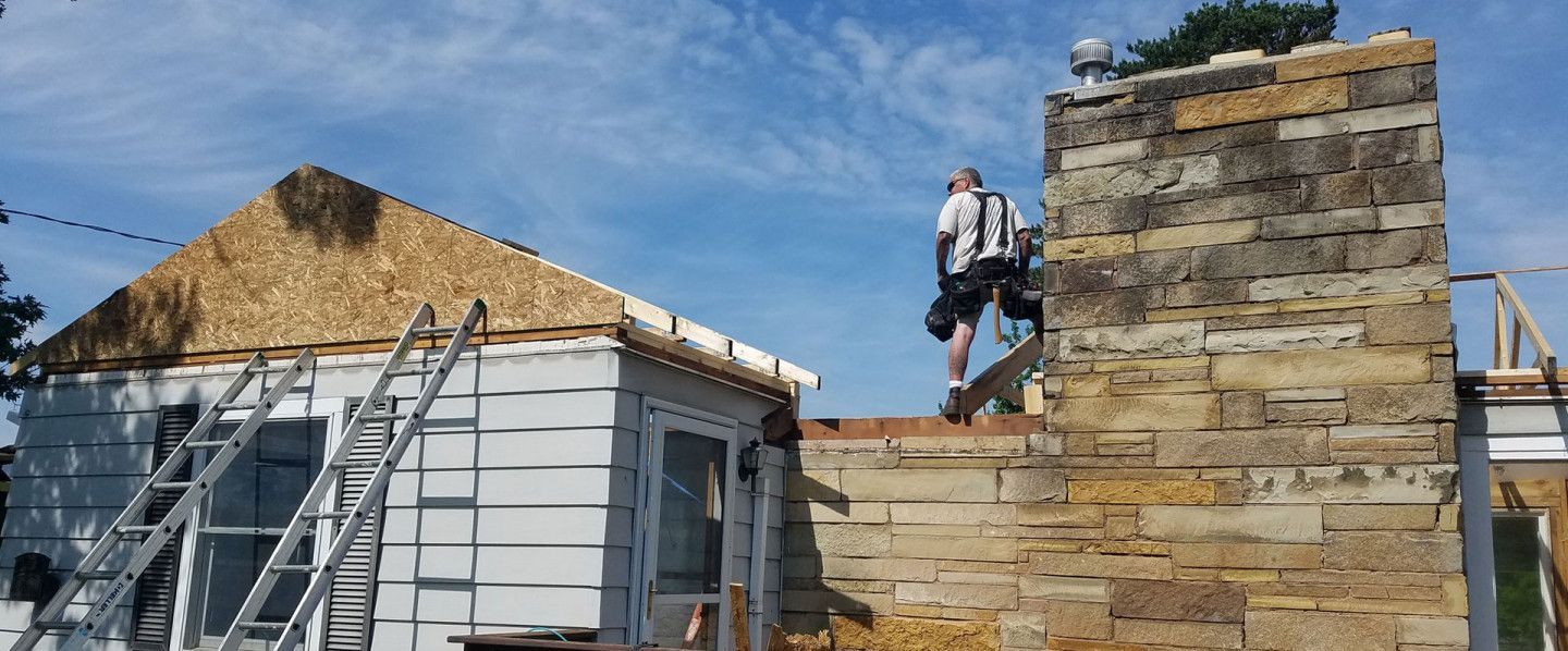 Professional Worker Inspecting a Roof