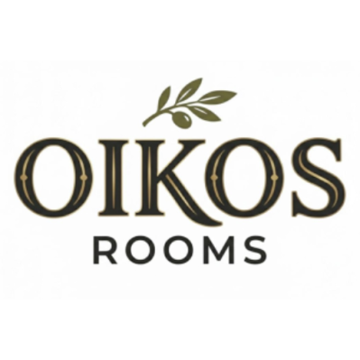 Logo OIKOS ROOMS in nero con un ramo d'ulivo verde sopra il testo