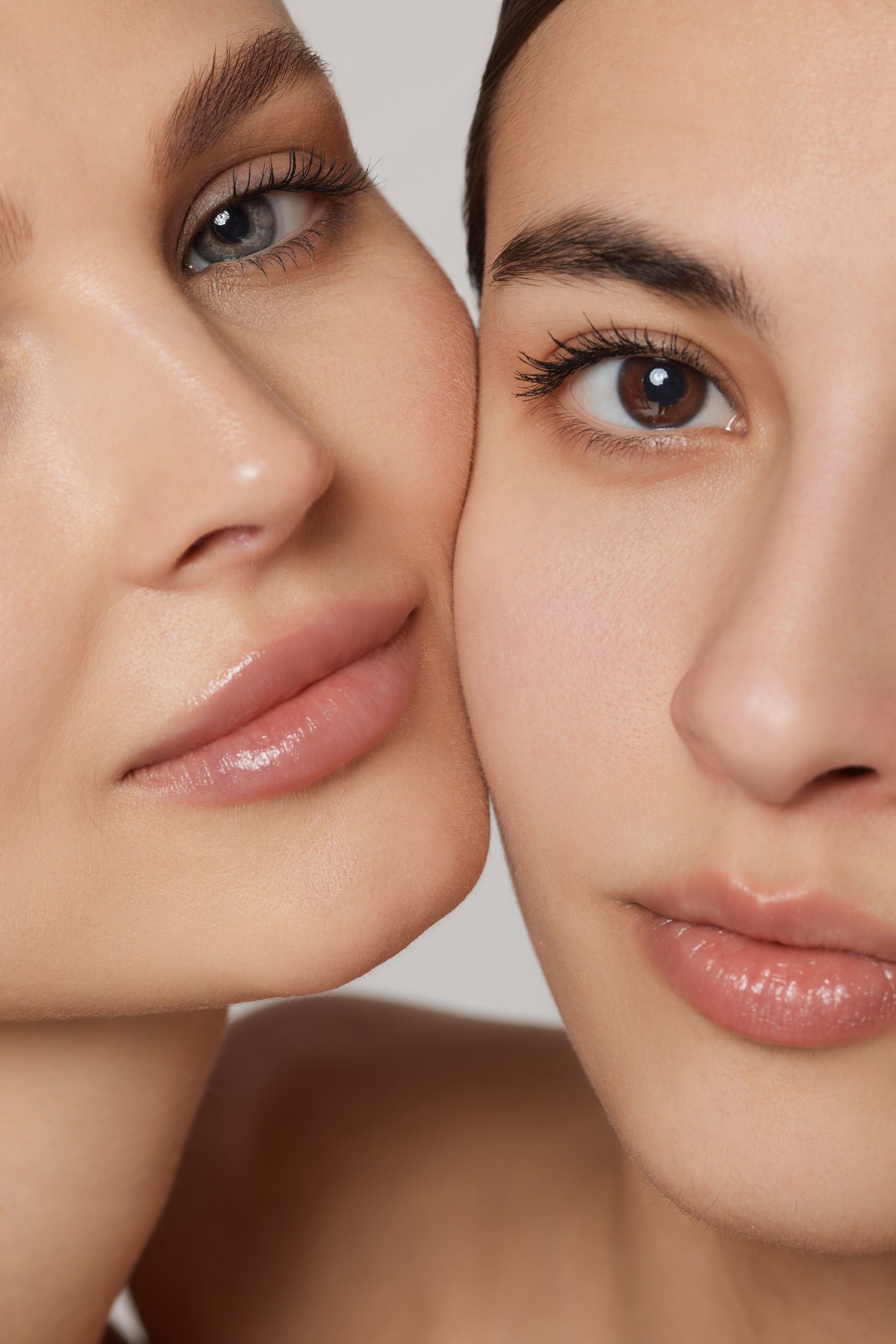 Two women are kissing each other on the cheek.